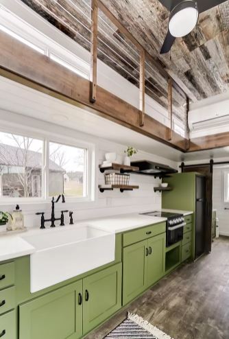 tiny home kitchen: Cabinetry with wood accents