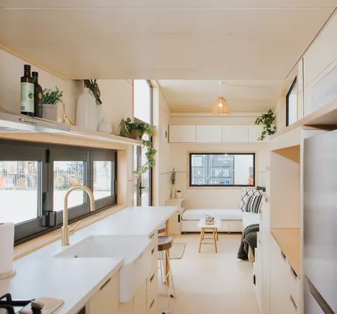 tiny home kitchen: Kitchen with flat-panel cabinets