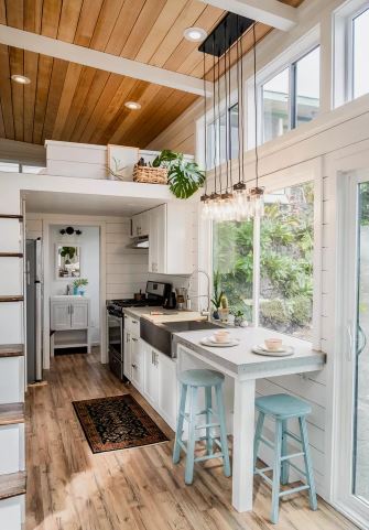 tiny home kitchen: Shiplap wall and windows