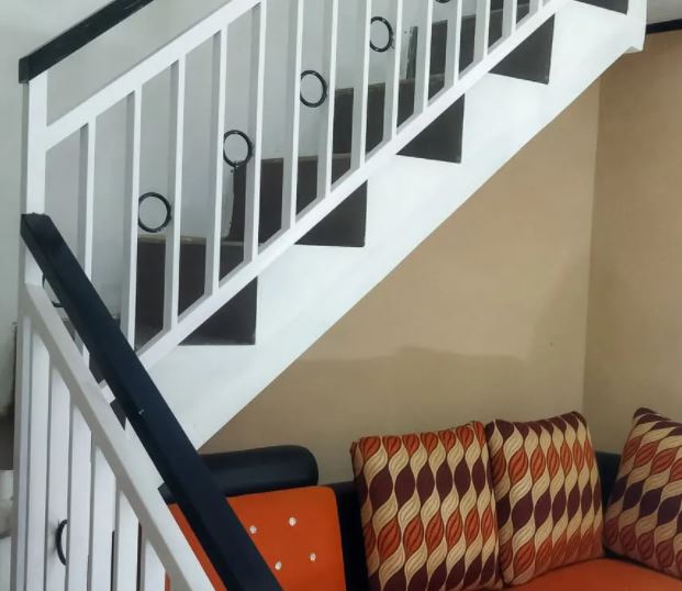 tiny home stairs: Sofa Underneath Staircase